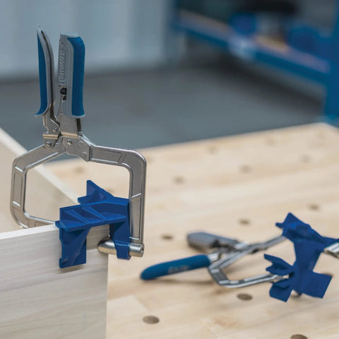 90 Degree Corner Clamp For Woodworking holding wood at right angle, featuring Automaxx Technology auto adjusts, pro-grade tool on table