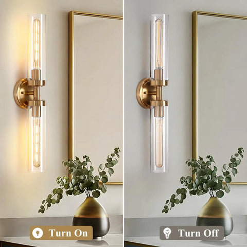 2-Light Gold Wall Sconces, Modern Bathroom Vanity Light with Glass Shades lit up next to a vase on a countertop.