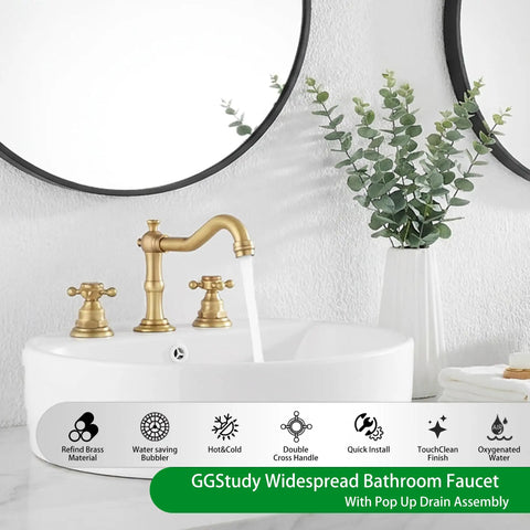 Super Stylish Two Handle Widespread Bathroom Sink Faucet In Warm Antique Brass Finish Including Matching Metal Pop Up Drain With Overflow For Your Vanity Basin Perfect Solid Brass Build Adjustable 8 To 16 Inch Centers installed on white vanity with round mirror and plant