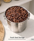 Heavy Duty 304 Stainless Steel Milk Can And Water Jug With Secure Airtight Lid Freestanding Drink Dispenser filled with coffee beans.