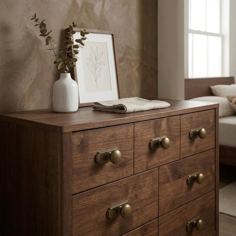 10 Pack 1 1/4 Inch Cabinet Knobs With Matching Backplates Antique Brass Vintage Drawer Pulls on a wooden dresser.