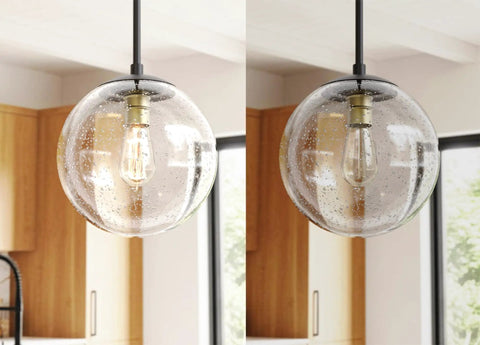 Globe Pendant Light In Black And Gold With Seeded Glass Shade Nine Point Five Inch Modern Ceiling Fixture in kitchen setting