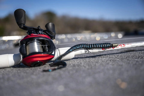 Plum Power Worm Soft Plastic Fishing Bait With Irresistible PowerBait Formula And Classic Curly Tail Profile, 10 Inch, 25 Cm, The Go To Bait For Spring Summer And Fall Fishing on fishing rod