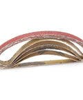 Badass Sandpaper Belt Replacement 20 Piece Set For Belt Sander Tools 330X10mm Abrasive Strips stacked for metal wood grinding.