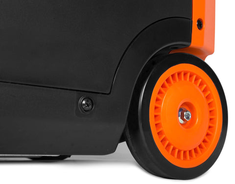 Close-up of the orange wheel of a quiet and lightweight 4800 watt RV ready portable inverter generator with fuel shut off and clean power.