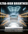 Geometric Hexagon Garage LED Light Panels With Blue Frame No-Fuss Install Ultra Bright 6500K 672W 86400LM 14 Grid Honeycomb Ceiling Lights illuminating a car workshop.