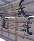 Garage Door Storage Rack for Fishing Gear 21 Inch Black ABS Rod Holder installed on garage door holding fishing rods