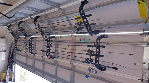 Garage Door Storage Rack for Fishing Gear 21 Inch Black ABS Rod Holder installed on garage door holding fishing rods