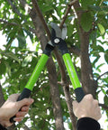Limb And Branch Pruner Tool Set With Heat Treated Steel 15 Inch Lopper cutting a tree branch with easy grip handles.