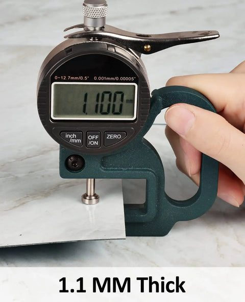 Measurement of Beige Marble Peel And Stick Vinyl Flooring 12x12 Self Adhesive Tiles Waterproof And Removable 20 Tiles Per Box Covering 20 Sq Ft Easy Install For Bathroom Kitchen Living Room Bedroom Renters Friendly Renovation showing 1.1 mm thickness with a caliper