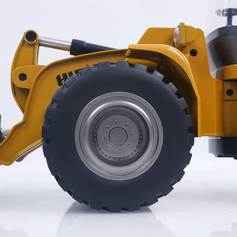 Side view of a Powerful 1 To 14 Scale RC Wheel Loader With 2 Point 4G Remote, showing alloy wheel and part of metal cab structure.