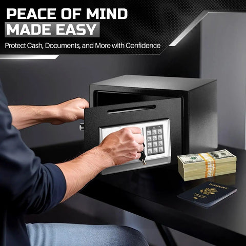 Person using drop slot money safe box with digital keypad lock for home office or cabinet, securing cash and documents.