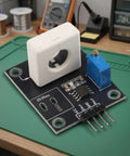 Dead Simple Hall Effect Current Sensor Module With 100A Rating for smooth analog outputs mounted on a green workbench.