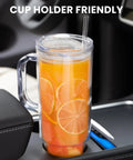 40 Oz Clear Double Wall Acrylic Tumbler With Handle And Straw Lid Reusable Water Bottle fits cup holders with citrus drink inside.