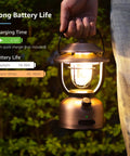 Person holding Rechargeable Vintage LED Camping Lantern With 15000mAh Battery, 1000 Lumen Output, Stepless Dimming, outdoors