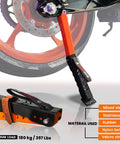 Portable Motorcycle Maintenance Stand With Adjustable Height Lift for chain cleaning and lubrication near rear motorcycle wheel.