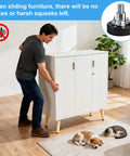 Person moving cabinet with Adjustable One Quarter Inch Thread Leveling Feet With T Nuts 12 Pack Screw In Furniture Levelers for smooth operation.