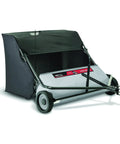 Heavy Hitter 42 Inch Ground Sweeper Featuring 22 Cubic Foot Hopper And Patented Spiral Polypropylene Brushes For No Fuss Lawn Cleanup And Quick Fold Down Storage, with collection bin and wheels.