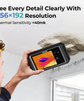 Game-Changing Thermal Imaging Camera With 256x192 IR Resolution being used on a wall, 5 inch touchscreen displaying heat map.
