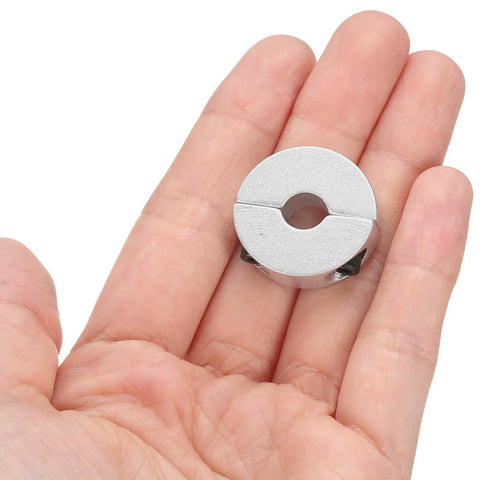 Six Piece Double Split Shaft Collar Set For 8mm Bore 25mm Outer Diameter 8mm Thick Aluminum shown on hand for scale