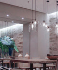 Dimmable LED Edison Bulb With Vintage Filament For A Retro Vibe, 5.5 Watt, 60W Equivalent, 500 Lumens hanging in modern room