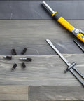 50 Piece M4x6 Stainless Steel Hex Ball Plunger Set Screws Tough As Nails Heavy Duty Fasteners arranged with tools on a work surface.
