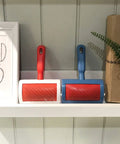 Red and blue curved slicker brushes for fur and sheepskin rugs pet grooming tool with stainless steel pins on shelf