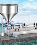 Kickin Performance Pneumatic Bottle Filler Machine With 40L Hopper, stainless steel, shown with a bottle being filled.
