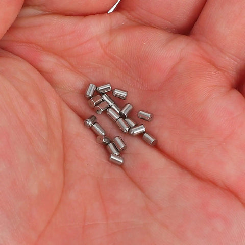 Stainless Steel Ball Catch Plungers For Cabinets And Closets 20 Pack Mini Latches shown in hand, wear resistant hardware