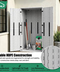 Beefy Heavy Duty Outdoor Tall Storage Cabinet Weatherproof 28 Cu Ft Garage Organizer With 4 Adjustable Shelves Locking Double Doors 31 W X 23 D X 66 H Inches Polar White Ideal For Home Garage Shed Or Outdoor Use displayed open with gardening tools inside on white patio