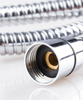 Close-up of a chrome-plated shower hose with a threaded connector against a white background.