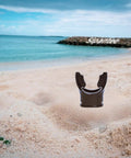 Black Silicone Scuba Mouthpiece For Snorkel Gear And Regulator Ties on sandy beach with ocean backdrop
