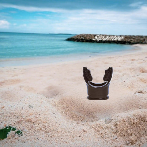Black Silicone Scuba Mouthpiece For Snorkel Gear And Regulator Ties on sandy beach with ocean backdrop