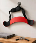 Arm Curl Isolator Training Aid With Upper Arm Stabilizer And Adjustable Strap Iron Board Support For Cleaner Bicep Form Home Gym Weightlifting Accessory For Safe Effective Workouts Red hanging on wall