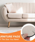 Hella Smooth Five Inch Felt Furniture Sliders Sturdy Eight Piece Round Movers For No Sweat Rearranging Reusable Moving Pads And Premium Floor Guards For Couches Tables And Hardwood Beige shown under a couch.