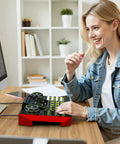 Woman using Pro Gaming Audio Mixer For Streaming And Podcasting With Built In Voice Changer USB Audio Interface at desk