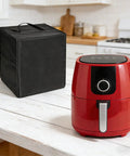 Heavy Duty Electric Frying Pan Protector Cover With Handle on a kitchen counter next to a red air fryer