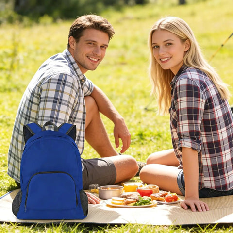Royal blue backpack from Two-Pack Lightweight Foldable Backpack Set Water-Resistant Packable 20L Travel Hiking Bags for Camping shown at picnic