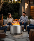 Friends sitting around 22 Inch Smokeless Outdoor Fire Pit With Waterproof Cover Stainless Steel Wood Burning Bonfire Pit For Camping Patio Or Backyard Hangouts Low Smoke Design For Cleaner Smoke And Cozy Warmth