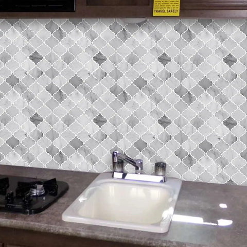Arabesque Peel And Stick Tiles For Kitchen Backsplash In Marble Gray, 12 By 12 Inch, installed above kitchen sink area