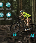 Cyclist riding with the Front And Rear Bike Axle Set for Mountain MTB Hollow Hub Shaft in forest, highlighting shock resistance features.