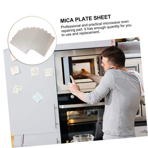 Man installing 12 Pieces Mica Sheets For Microwave Oven Waveguide Cover Heat Resistant Fireproof Insulation Pads in kitchen