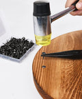 Top Shelf Vintage Flower Upholstery Tacks 200 Pack Small 5/16 Inch Head Nails being nailed into wood with pliers.