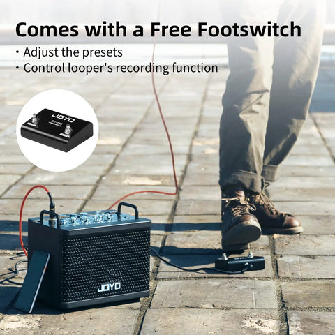 Person using 15W Portable Guitar Amp With 9 Preamp Models, Looper, Drum Machine, and footswitch on paved ground in sunlight