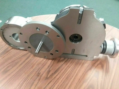 12 Inch Precision Rotary Table Featuring Killer Accuracy 10 Inch 3 Jaw Chuck Reversible Jaws Index Plates Smooth Operation Shop Ready side view on wood