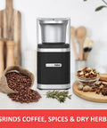 Electric Coffee Bean Grinder With Slick One Touch Operation And 180W Motor brewing fresh espresso right quick with a removable stainless bowl in sleek black next to coffee beans.