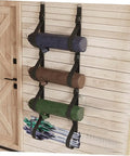 Heavy Duty Adjustable Wall Storage Straps With Badass Rugged Buckles Perfect For Camping Chairs Yoga Mats And Tents, holding three rolled items.