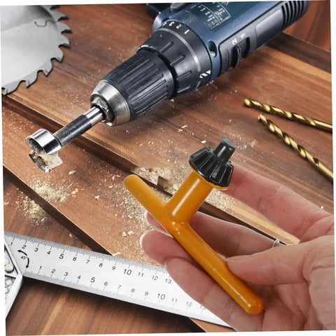Heavy Duty 4 Piece Drill Press Chuck Key Replacement Set With Ergonomic Non Slip Rubber Handles For 10mm 13mm 16mm 20mm Electric Drill No Sweat Grip Setup, yellow chuck key in hand.