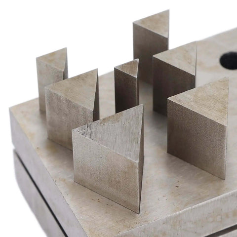 Close-up of Punch Die Set For Metal Forming With Assorted Shapes And Disc Cutter Capabilities showing triangle die shapes.