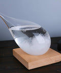 Storm Glass Weather Predictor Barometer Bottle With Wood Base For Home And Office Decor And Weather Station on a desk